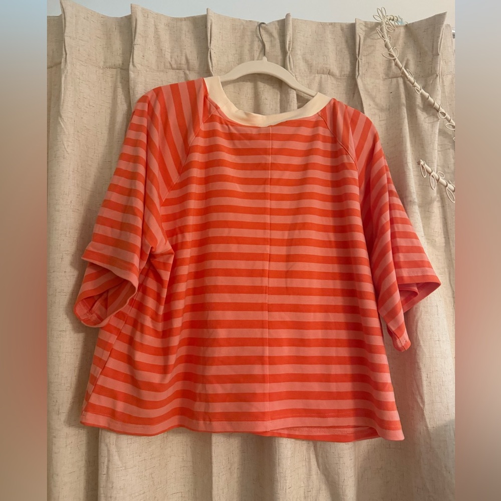 Striped Orange and Pink athletic crop top
Fits like an oversized medium